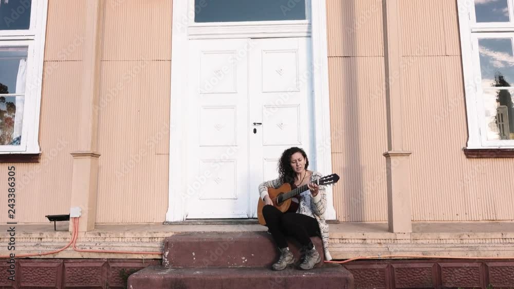 Hispanic woman playing alone outside of home. 4k Hispanic woman playing alone outside of home. 4k