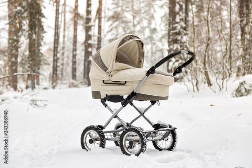 Wallpaper Mural Baby stroller in winter forest. tire tracks on snow. Infant baby sleep inside the pram on fresh air Torontodigital.ca