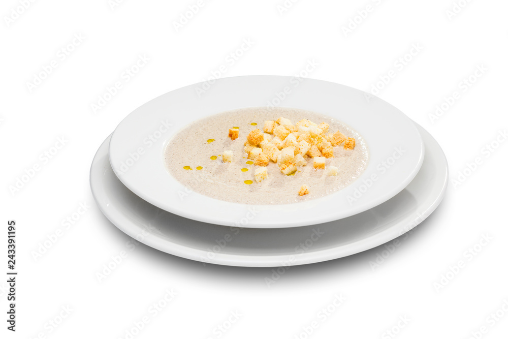 mushroom soup with croutons in a round white plate mushroom soup with croutons in a round white plate