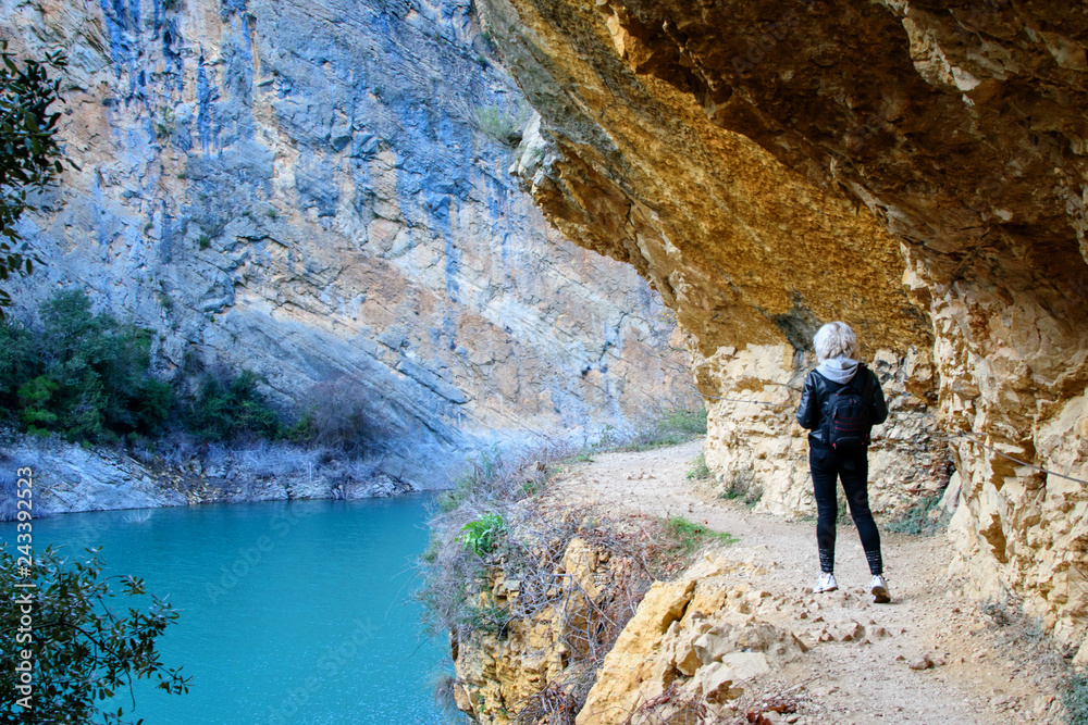 Travelling walking girl in the valley of the mountains.