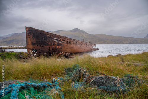 Rusty shipwreck on the coast at Djupavik, Iceland.