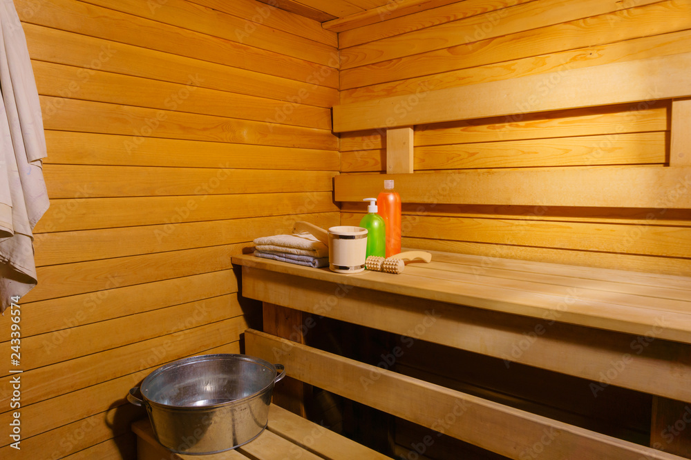 fragment of the interior of a small modern Russian banya with some bath accessories.. fragment of the interior of a small modern Russian banya with some bath accessories..