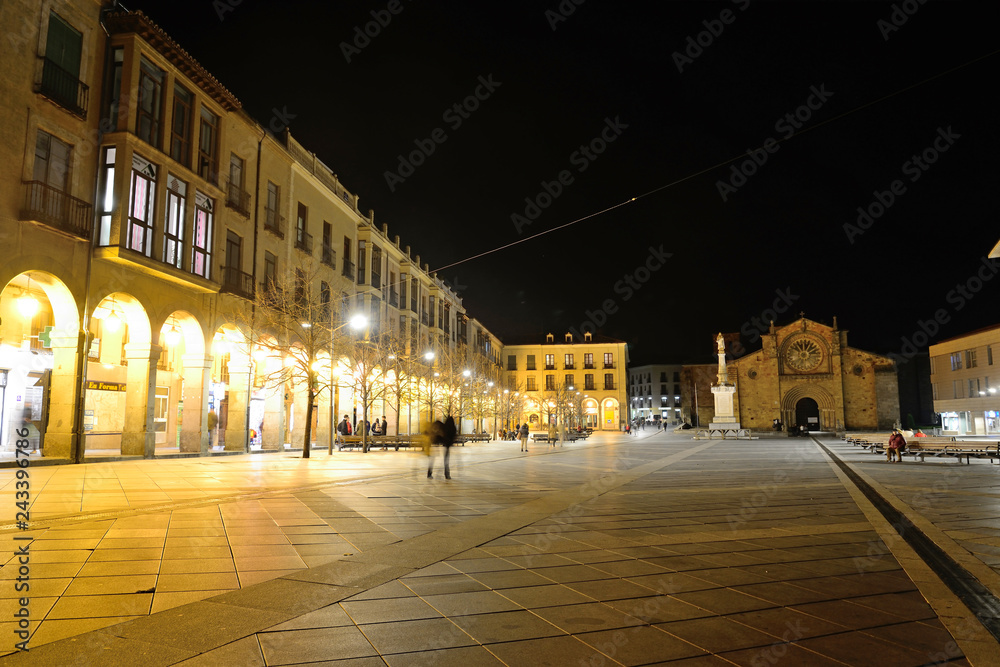 Ávila, Spain - November 15, 2018: Square of Santa Teresa de Jesus and the Parish of San Pedro Apostol in the background.