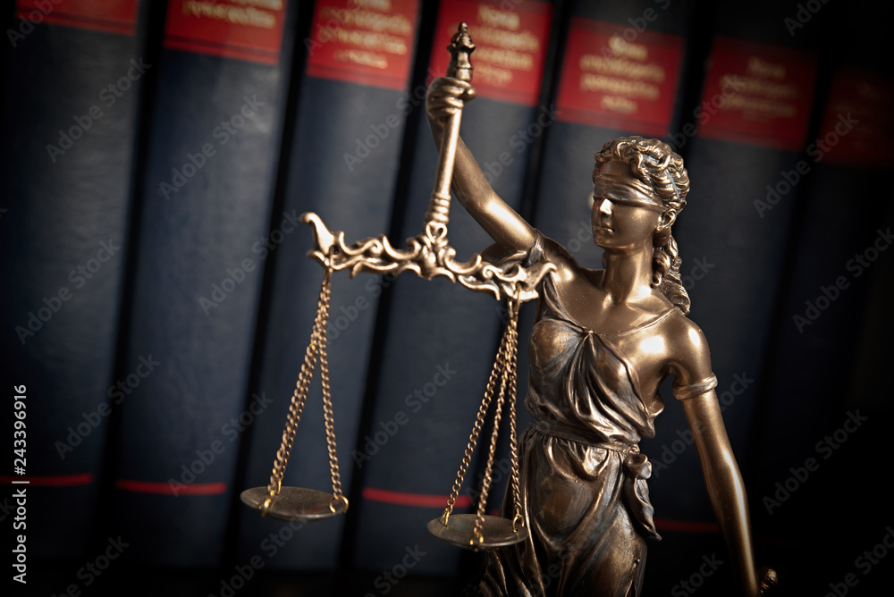 Statue of justice on books background Statue of justice on books background