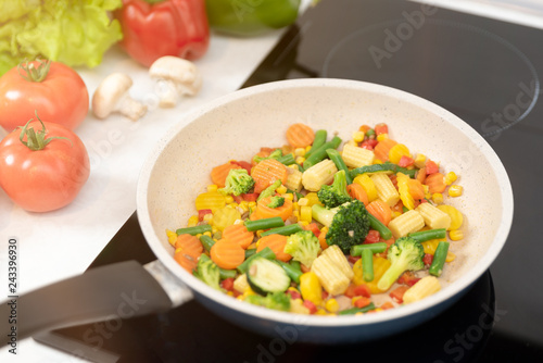 Fresh vegetables fried in a pan. Healthy nutrition concept