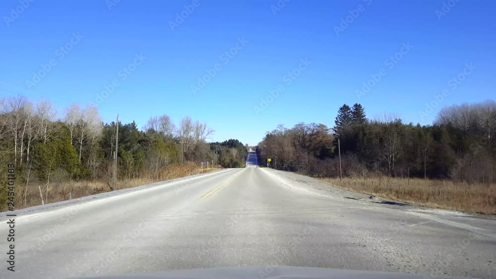 Driving Rural Road During Day. Driver Point of View POV Countryside Street in Daytime. Driving Rural Road During Day. Driver Point of View POV Countryside Street in Daytime.