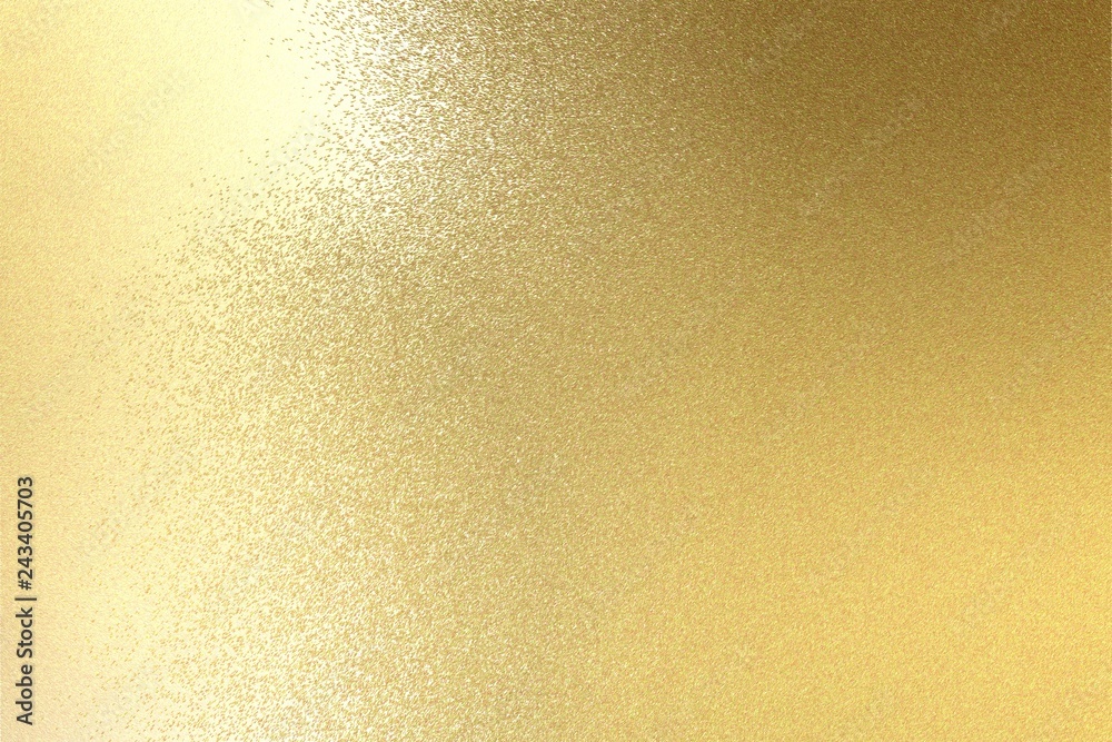 Light shining on brushed gold metal plate texture, abstract background Light shining on brushed gold metal plate texture, abstract background