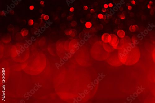 Valentine's day red lights defocused background. Red bokeh concept. photo