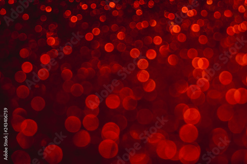 Valentine's day red lights defocused background. Red bokeh concept.