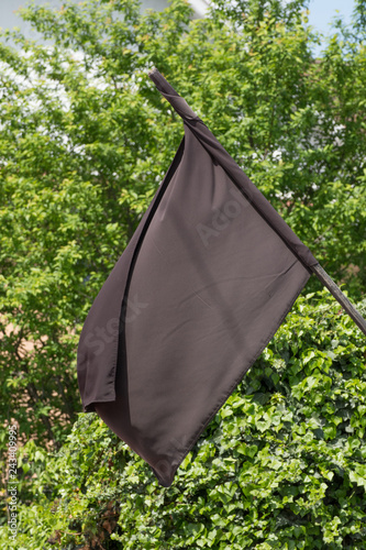 A black flag flies to the chapel