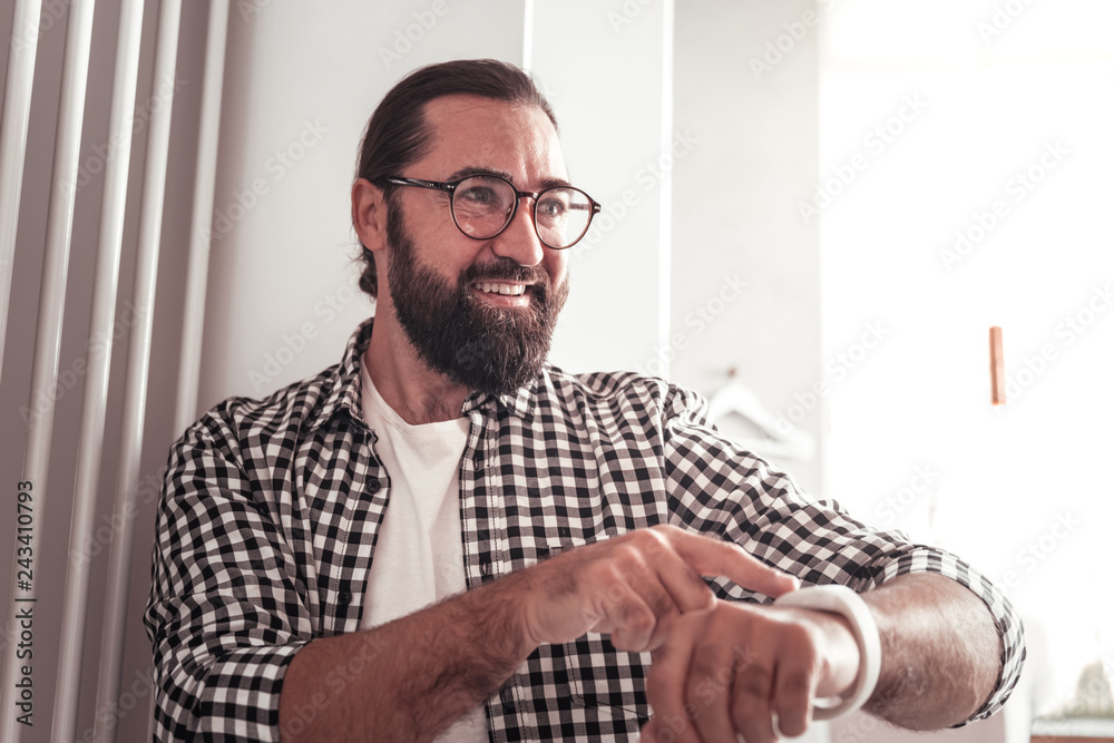Fototapeta premium Man pointing on his watch asking to be in time