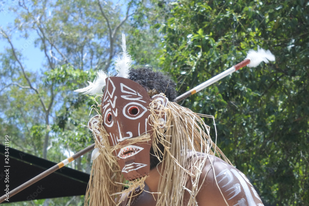 Unrecognizable Torres Strait Islander man dancing traditional dance in