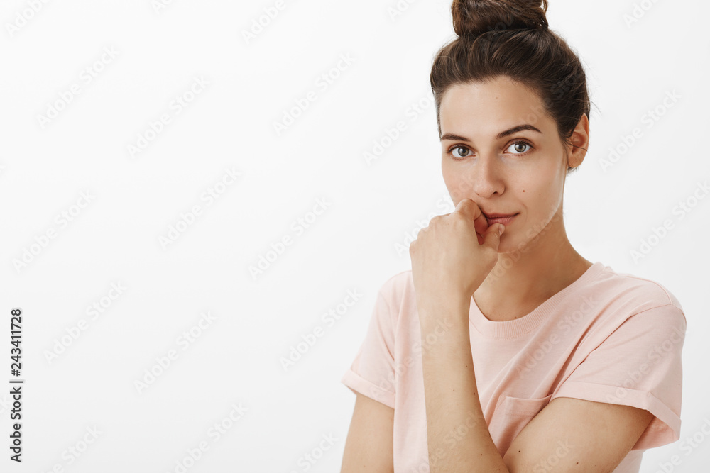 Attractive flirty and sensual european woman with cute messy bun smiling naughty touching lips and gazing at camera with desire as if wanting to kiss friend at party waiting first step Attractive flirty and sensual european woman with cute messy bun smiling naughty touching lips and gazing at camera with desire as if wanting to kiss friend at party waiting first step