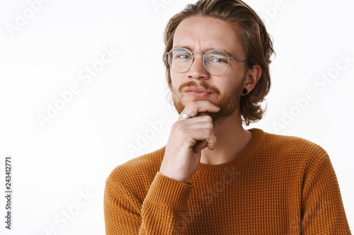 Fotografija Studio shot of hesitant and unsure good-looking young redhead guy with pierced n