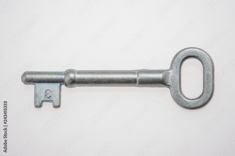 An Old-Fashioned Key on a White Background An Old-Fashioned Key on a White Background