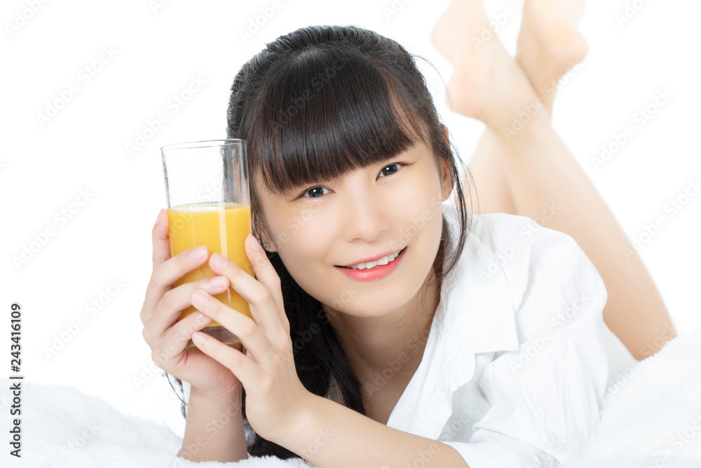 Chinese woman drinking orange juice isolated on white background Chinese woman drinking orange juice isolated on white background