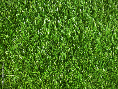 close up pattern of artificial healthy green grass, texture of green grass top view background, closeup of artificial green mat or carpet texture background