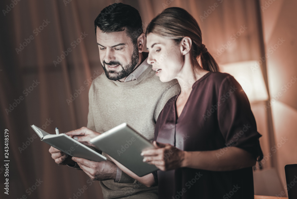Ambitious two colleagues checking information Ambitious two colleagues checking information