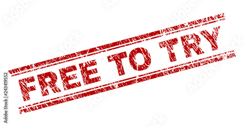 FREE TO TRY seal print with grunge texture. Red vector rubber print of FREE TO TRY caption with dirty texture. Text caption is placed between double parallel lines.