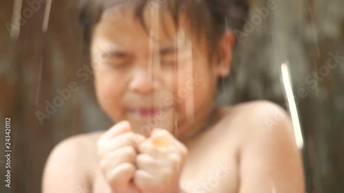 Thai child playing  with water ballon 
