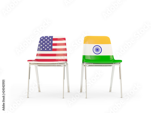 Two chairs with flags of US and india isolated on white