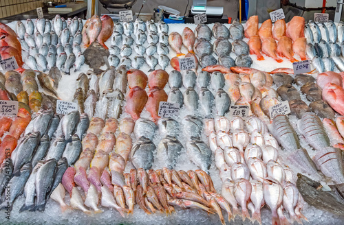 Great choice of fresh fish for sale at a market in Brixton, London photo