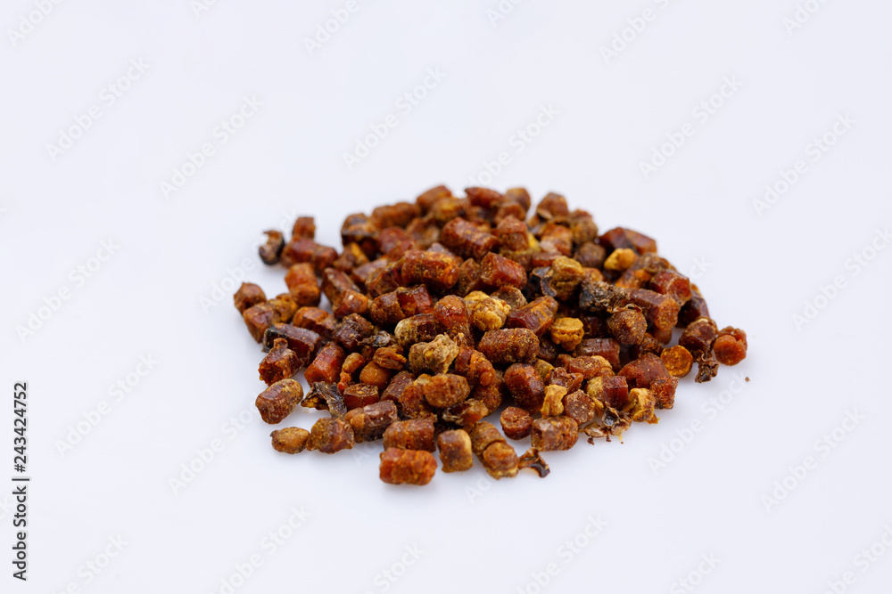 Fototapeta premium A bunch of propolis on a white background. Bee product. Close-up.