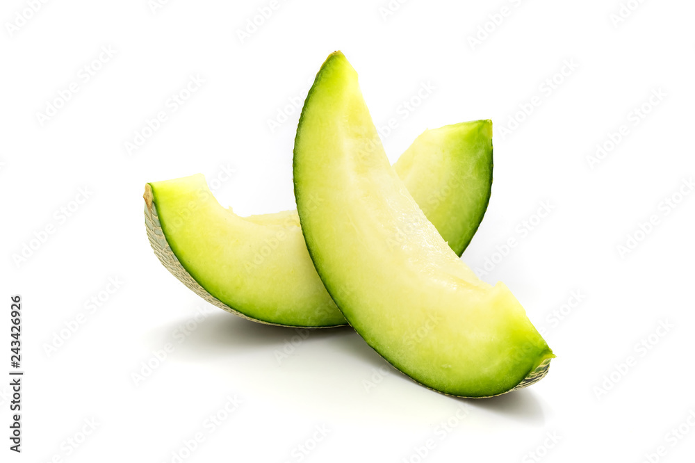 Green melon slices isolated on white background. Green melon slices isolated on white background.