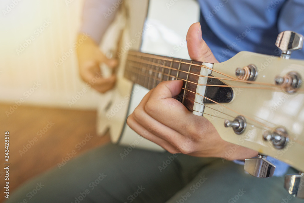Man playing guitar , close up	
