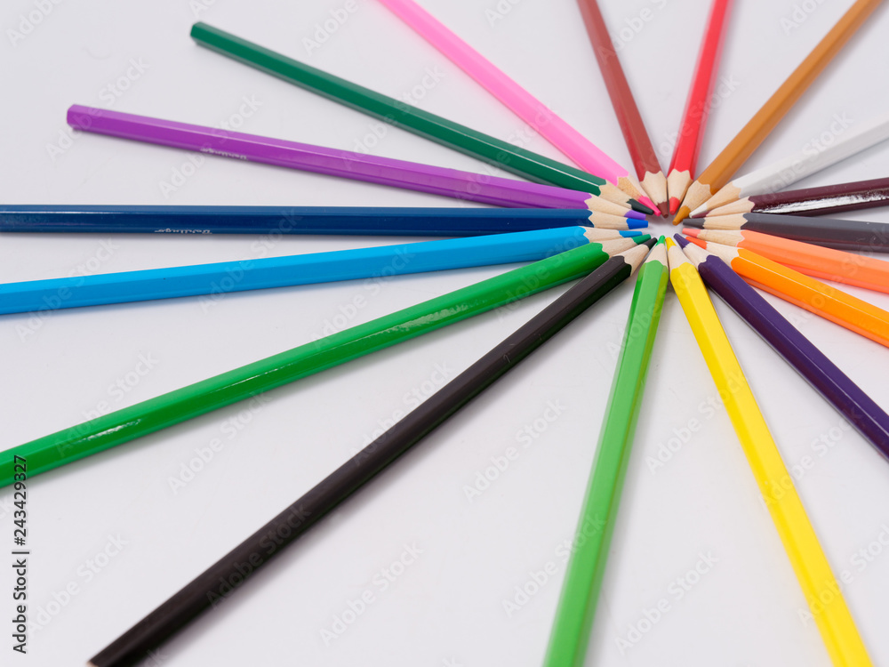 Fototapeta premium colored pencils sharpened on a white background.