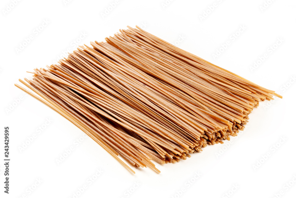 Dried soba, buckwheat noodles on a white background with a place for text Dried soba, buckwheat noodles on a white background with a place for text