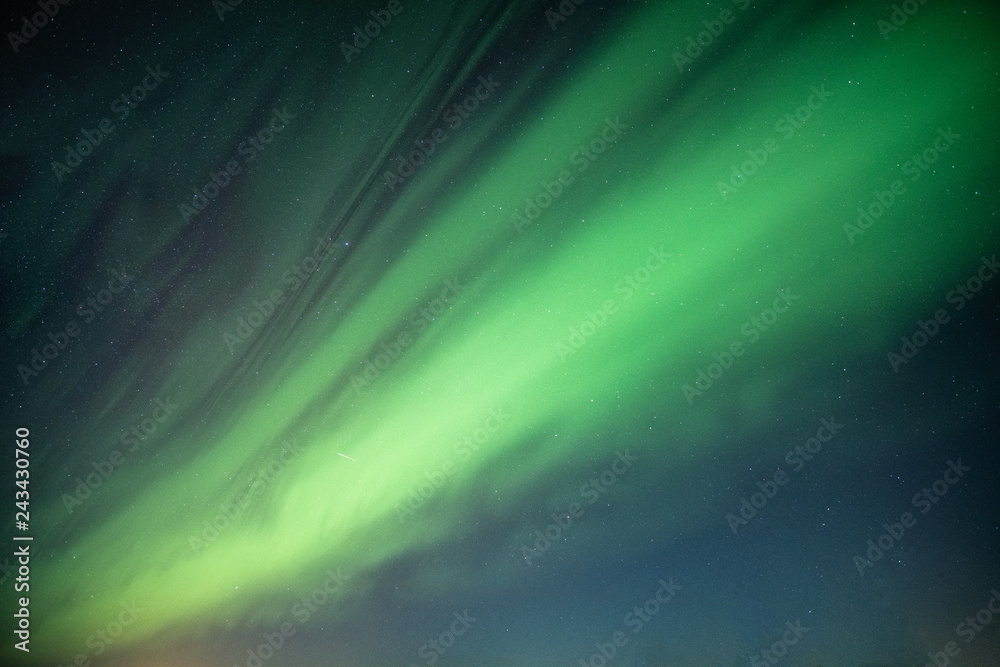 Beautiful Northern lights, Aurora borealis dancing on night sky