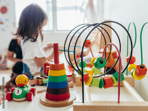 Young girl playing with educational toys photo