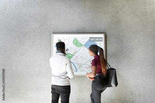 Tourists looking at a guide map photo