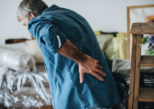 Senior man having back pain photo