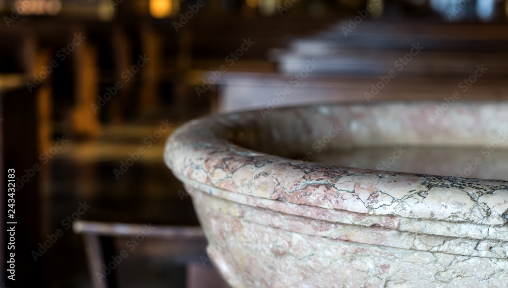 Fototapeta premium old baptismal font in a church 