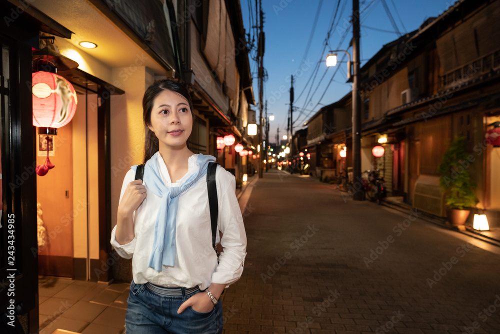 girl tourist walking along in Hanamikoji Dori girl tourist walking along in Hanamikoji Dori