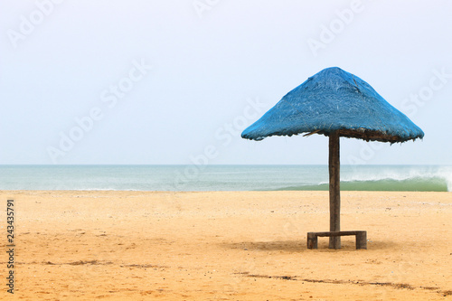 Beautiful palm tree sun umbrella on the beach