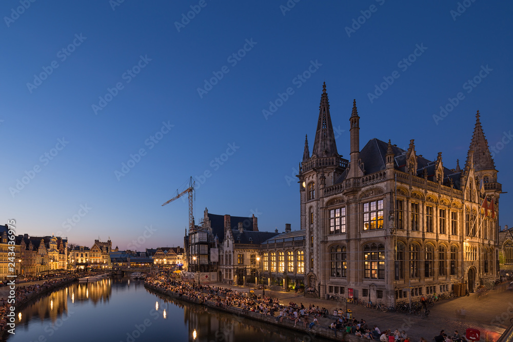 Night view of embankment Graslei and medieval buildings. Former center of the medieval harbor. Ghent, Belgium.