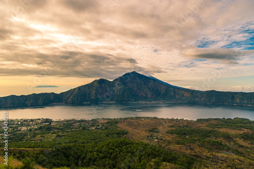 Sunrise volcano landscape view from the top of mount Batur in Bali, Indonesia.