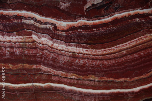 Beautiful background of natural stone onyx red with white veins, called Onice Fantastico
