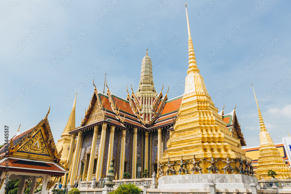 Fototapeta premium The beauty of the Emerald Buddha Temple . And while the gold of the temple catching the light. This is an important buddhist temple of thailand and a famous tourist destination.