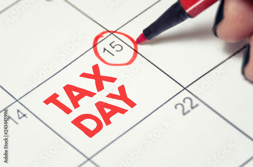 Tax day concept. The USA tax due date marked on the calendar.