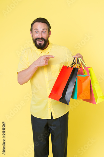 Best outfit ever. brutal caucasian hipster with moustache. Bearded man with shopping bags. Happy holidays. big sale in shopping mall. shopping. Mature hipster with beard. Successful shopping