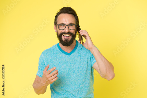 brutal caucasian hipster with moustache. happy conversation. Business. Bearded man speaking on phone. modern life with digital technology. Mature hipster with beard. Confident and handsome Brutal man © be free