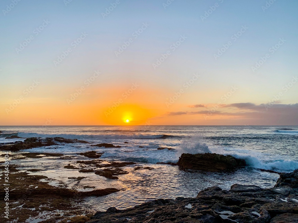 Sunset over the Atlantic ocean and stony coast of Fuerteventura