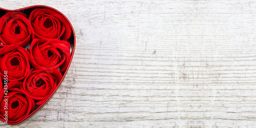 Red roses in a heart-shaped box