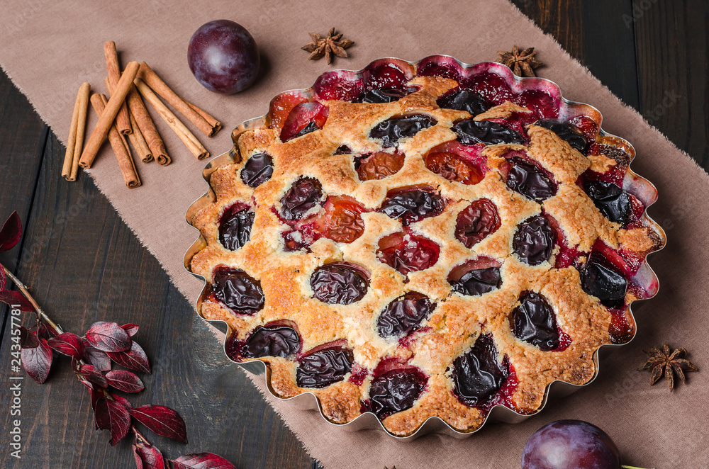 Plum pie on a dark background. Plum pie on a dark background.