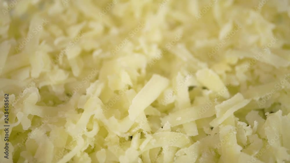 4k, close up grated boiled potatoes,Cooked potatoes being seasoned with fresh, grated nutmeg 4k, close up grated boiled potatoes,Cooked potatoes being seasoned with fresh, grated nutmeg