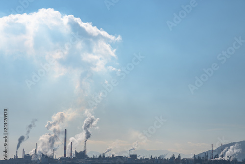 It is a view overlooking Otake industrial area from around Kuga station. You can see the chimney of the factory in the exhaust. photo